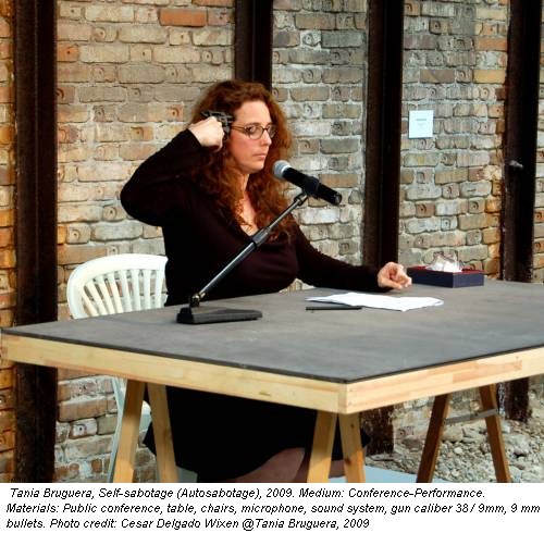 Tania Bruguera, Self-sabotage (Autosabotage), 2009. Medium: Conference-Performance. Materials: Public conference, table, chairs, microphone, sound system, gun caliber 38 / 9mm, 9 mm bullets. Photo credit: Cesar Delgado Wixen @Tania Bruguera, 2009