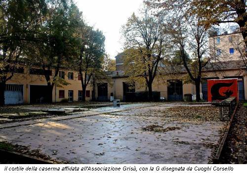 il cortile della caserma affidata all'Associazione Grisù, con la G disegnata da Cuoghi Corsello