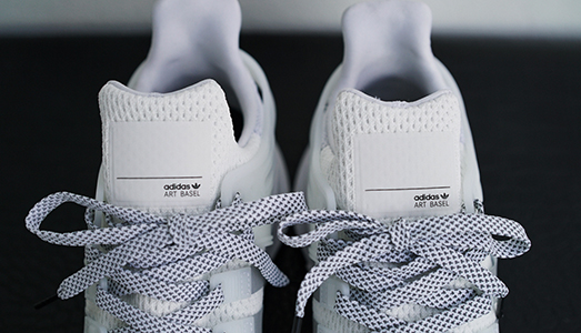 Art Basel la spunta su Adidas