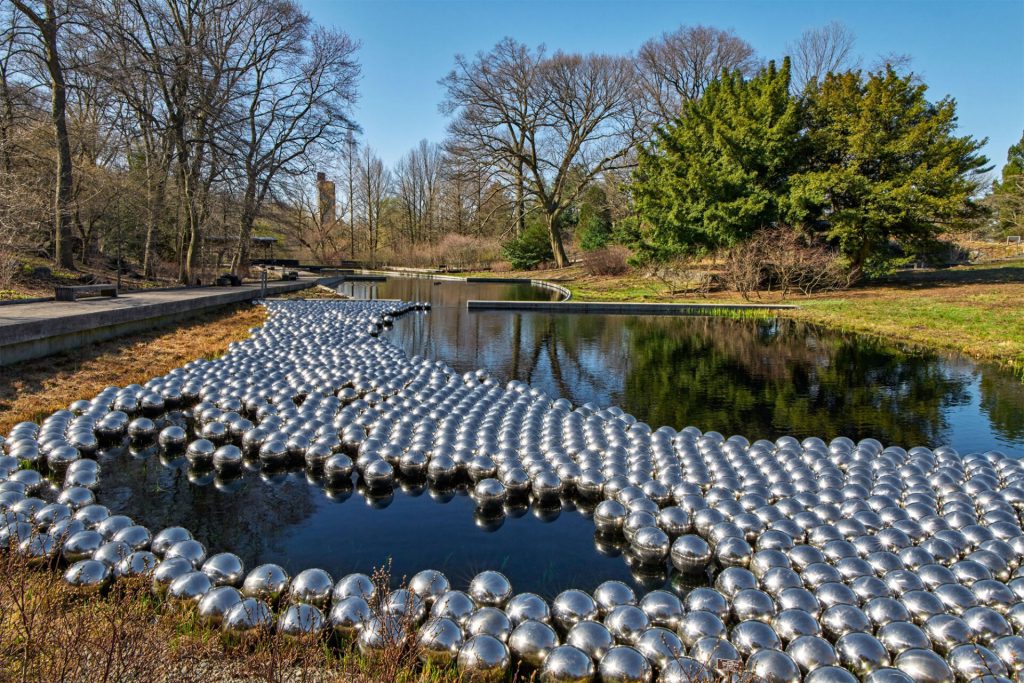 “Narcissus Garden” (1966/2021), view at The New York Botanical Garden, 1,400 stainless steel spheres, installation dimensions variable. Collection of the artist, courtesy of Ota Fine Arts