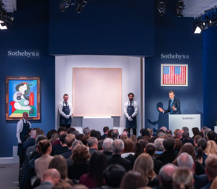 Sotheby's Chairman and Auctioneer Oliver Barker fielding bids during the auction-1 sotheby's 2023