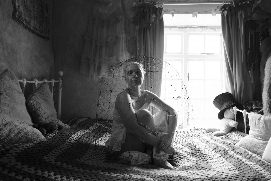 Sarah Grounds, Cages, 2024, B&W photo of an installation and performance in my own home