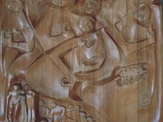 "Umanità migrante" Scultura bassorilievo ligneo