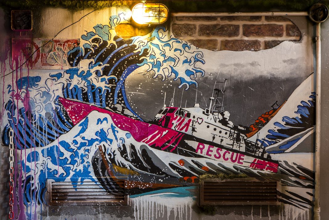 Mr. Savethewall –  Wallsavedhttps://www.exibart.com/repository/media/formidable/11/Mr.Savethewall-Wallsaved_La_Grande_Ondata-100x150cm-mixed_media-_MG_1761-2020-1068x714.jpg