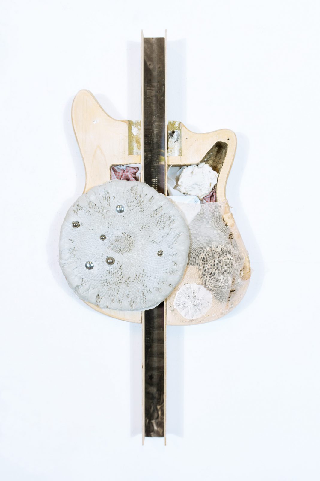 Ania Bak – Result of Influencehttps://www.exibart.com/repository/media/formidable/11/img/0ed/04_There-is-a-broken-open-place-in-a-lover_2025_80×40×11cm_guitar-body-plywood-print-on-fabric-textiles-bee-nest-sunflower-plaster-steel-epoxy-glue-1068x1601.jpg
